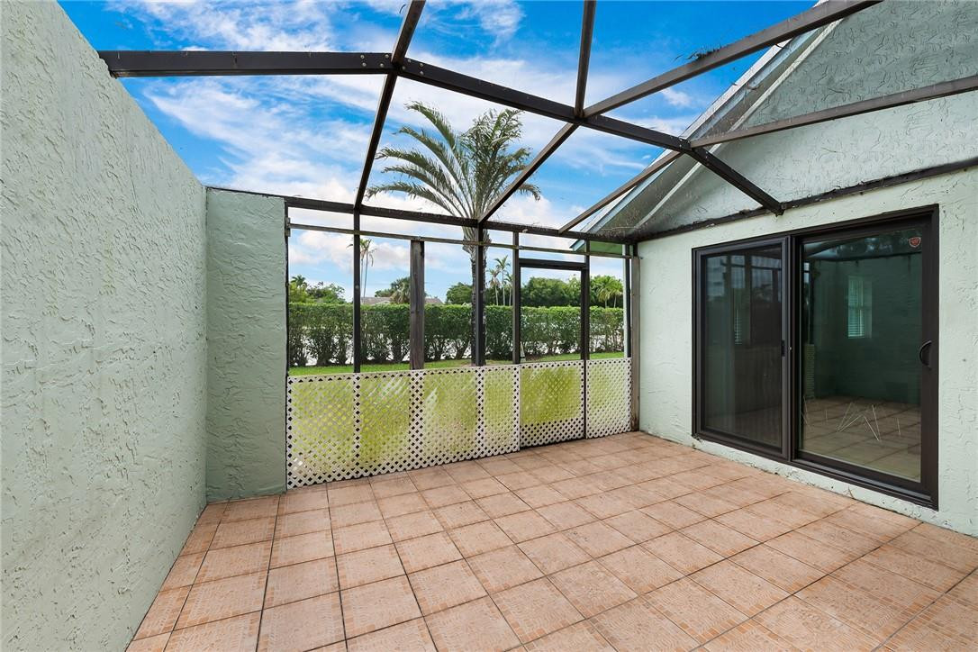 9085 Southwest 20th Street, Unit D Boca Raton, FL 33428 - Photo 20 of 25 a room with a large window