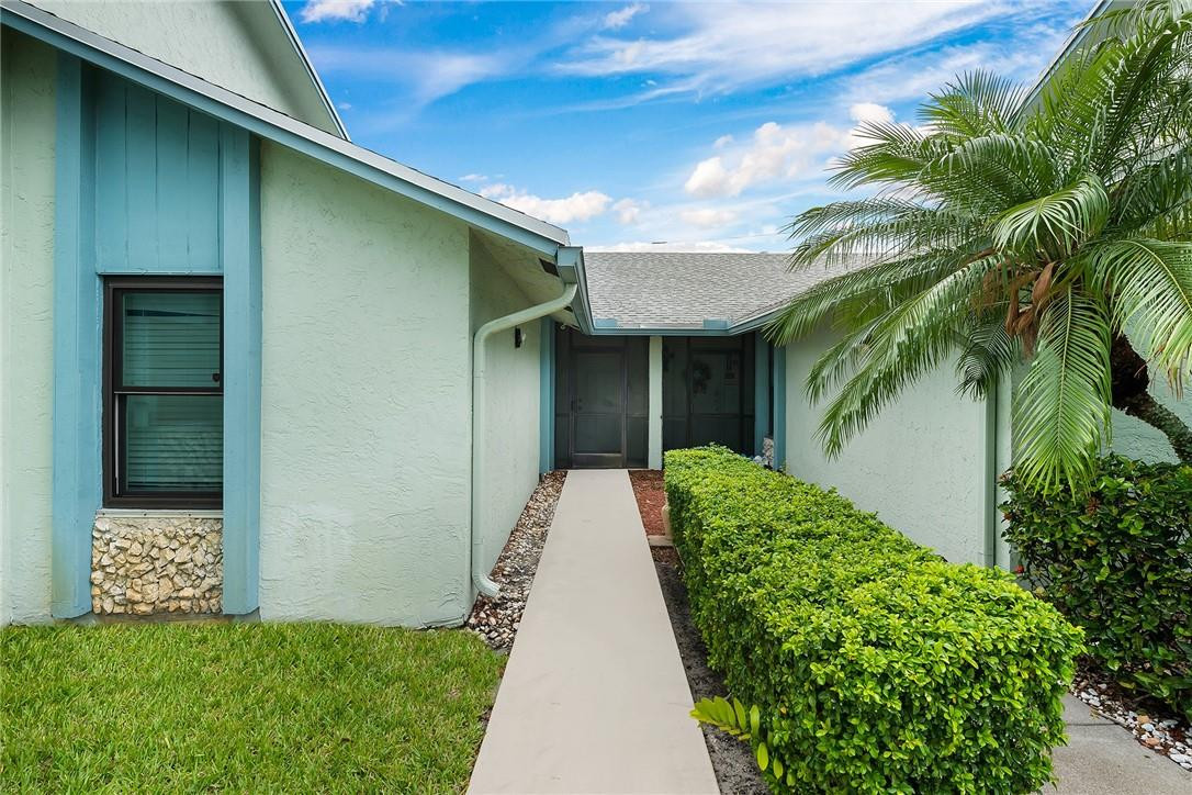 9085 Southwest 20th Street, Unit D Boca Raton, FL 33428 - Photo 2 of 25 a view of a back yard of a house