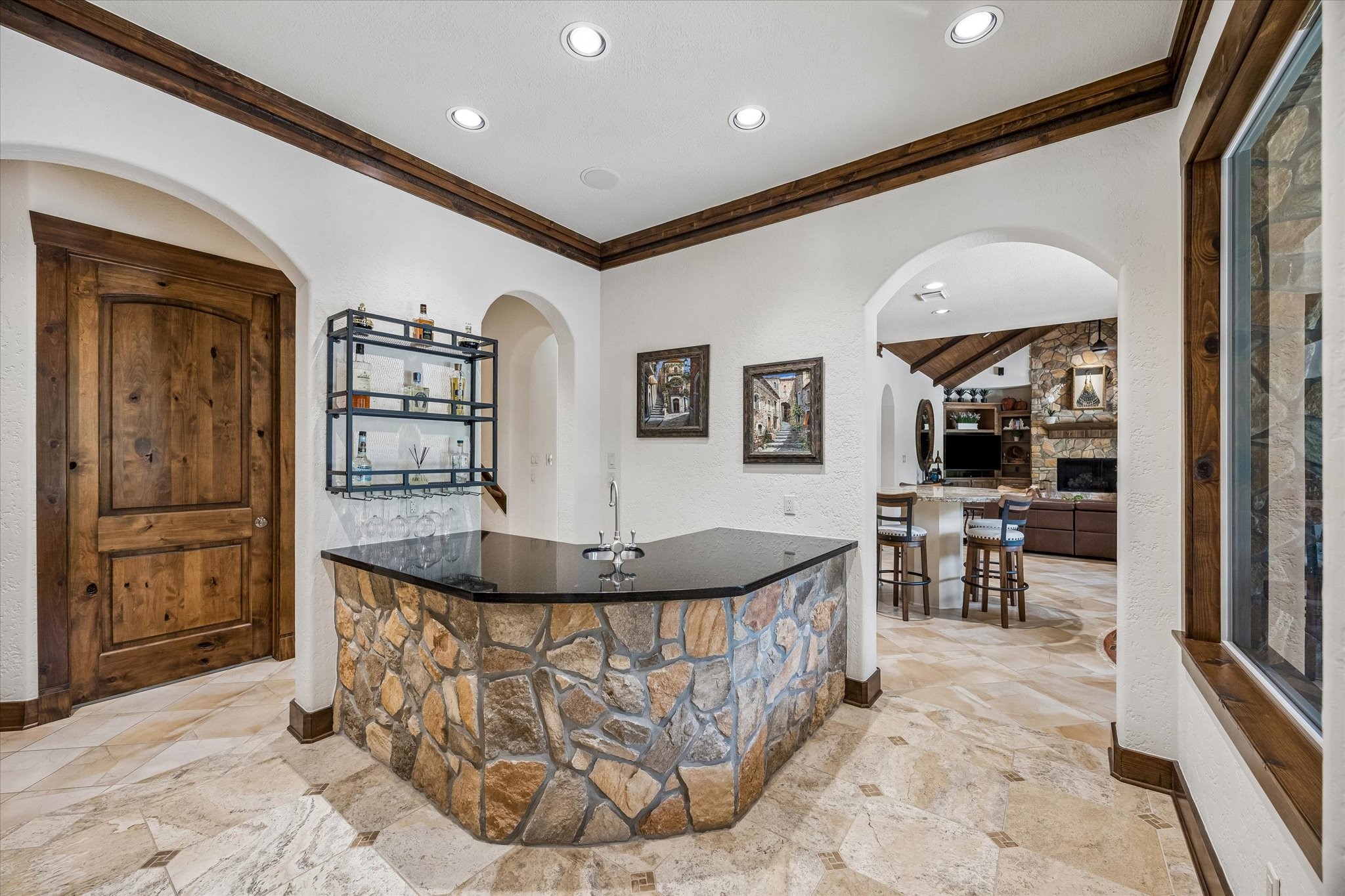 32102 Fulbrook Commons Fulshear, TX 77441 - Photo 12 of 50 Perfectly positioned, the wet bar adds convenience and sophistication for hosting family and friends.