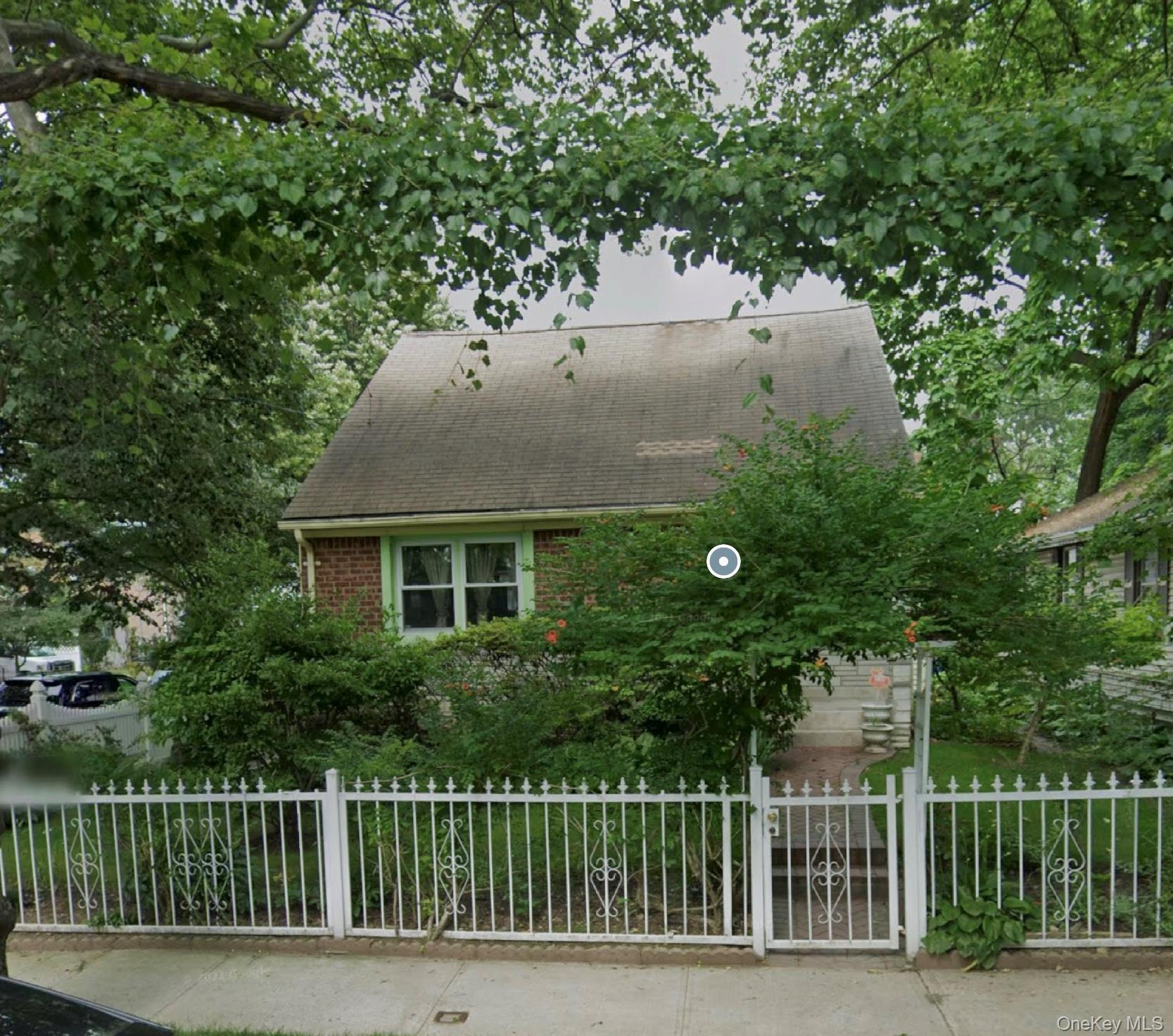 46-27 206th Street Queens, NY 11361 - Photo 1 of 2 a house view with a garden