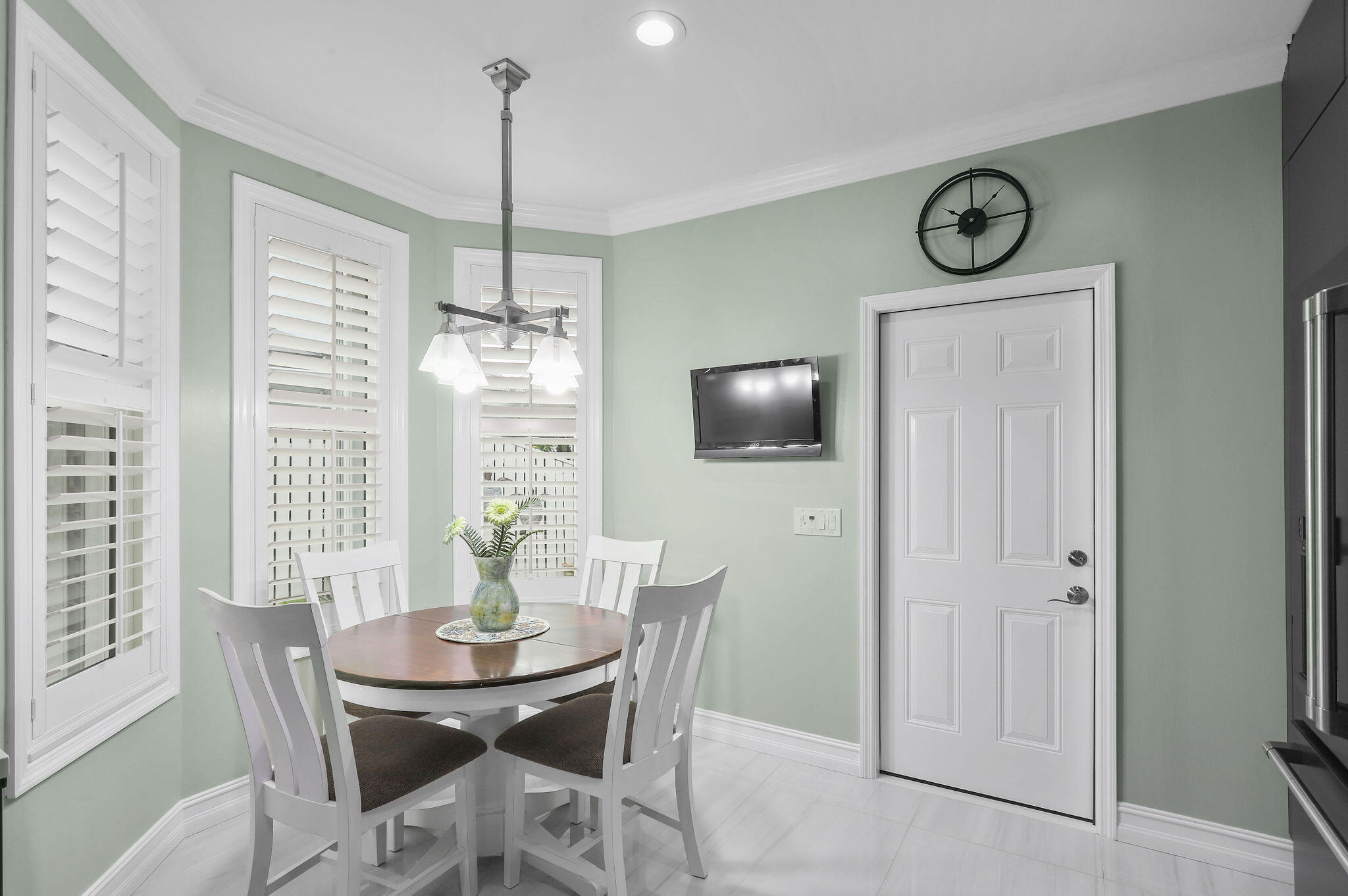 2056 Windward Way Jupiter, FL 33477 - Photo 11 of 58 a view of a dining room with furniture window and wooden floor