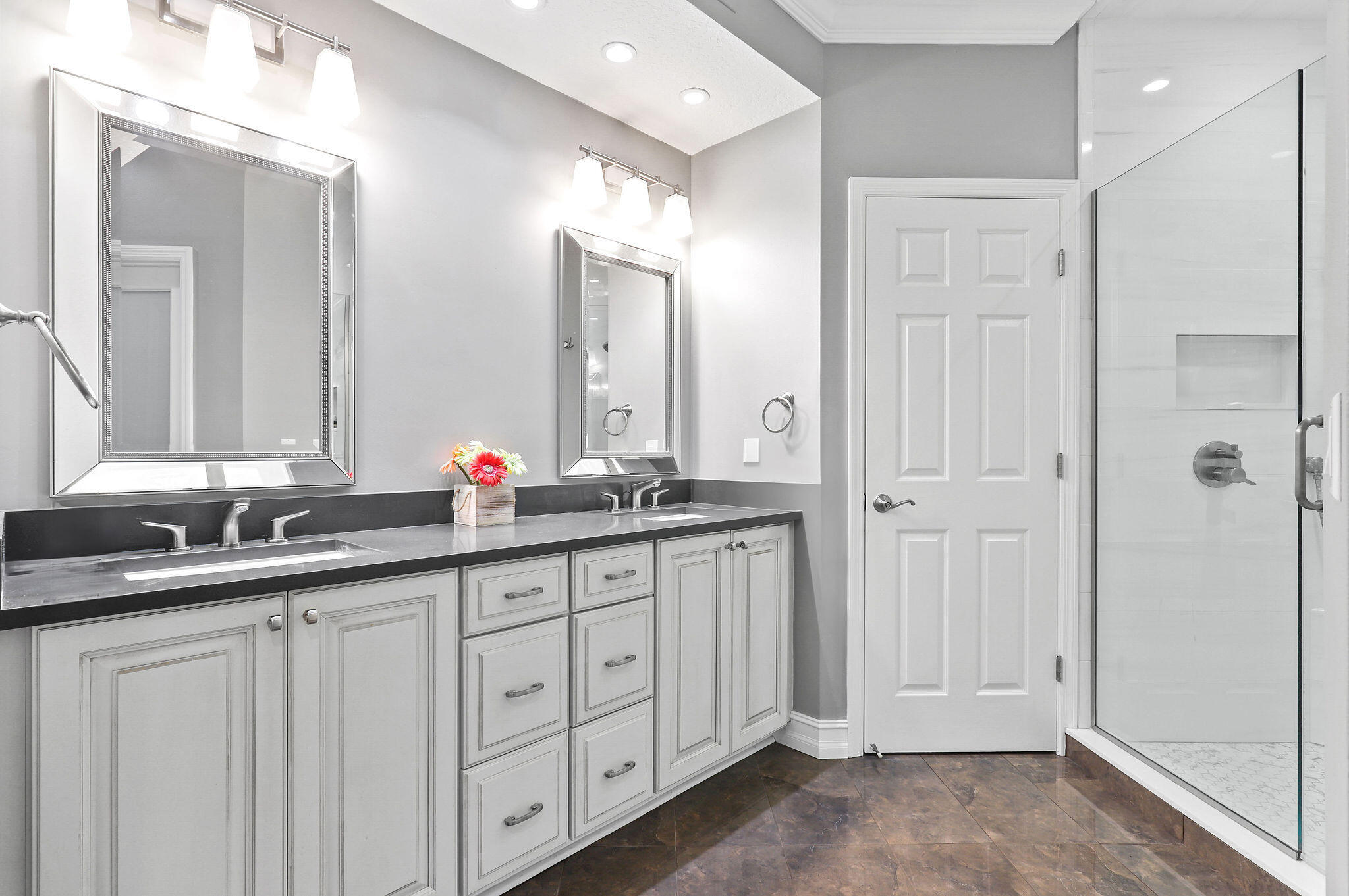 2056 Windward Way Jupiter, FL 33477 - Photo 16 of 58 a bathroom with double sink and a mirror