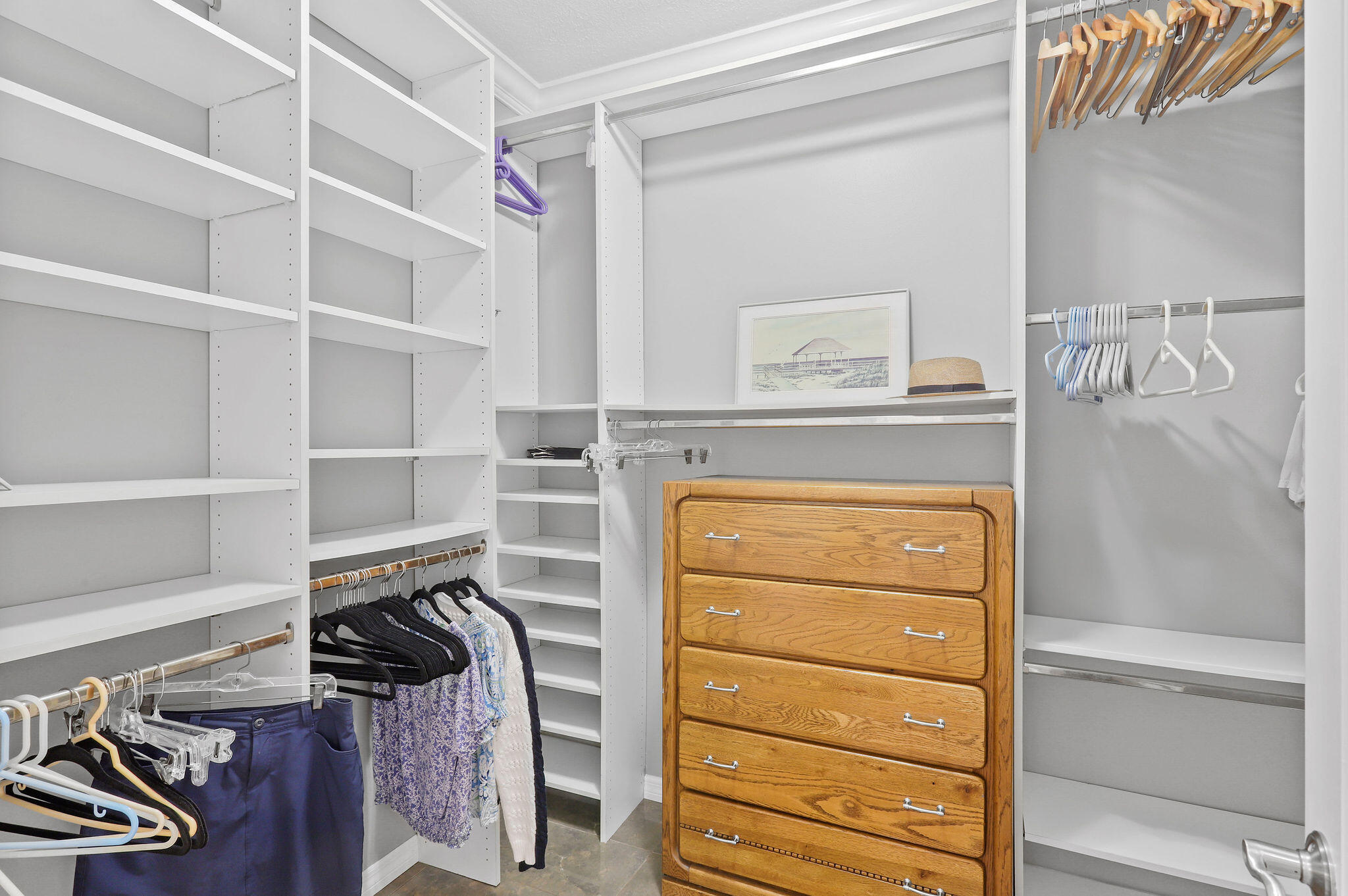 2056 Windward Way Jupiter, FL 33477 - Photo 18 of 58 a view of walk in closet with clothes and shoes