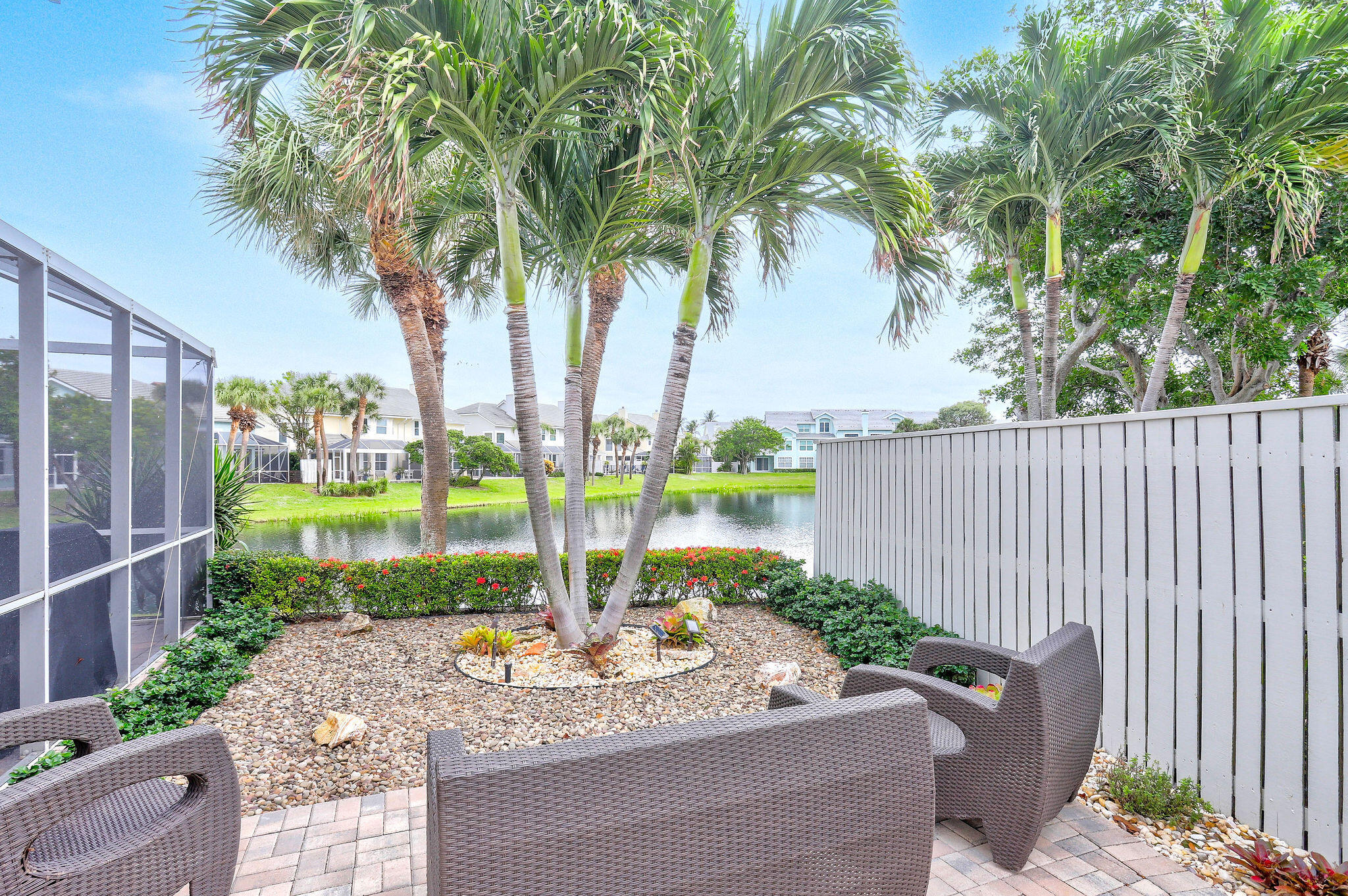 2056 Windward Way Jupiter, FL 33477 - Photo 43 of 58 a view of swimming pool with a patio and plants