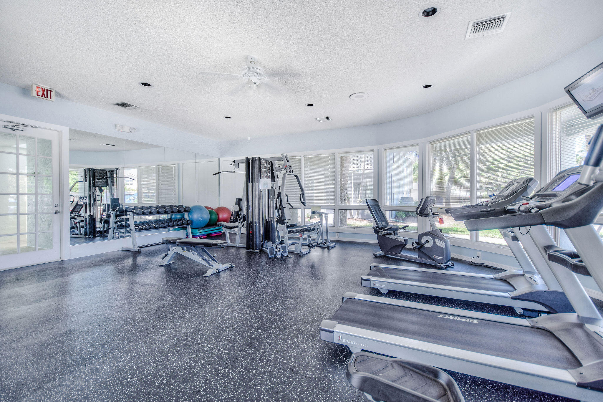 2056 Windward Way Jupiter, FL 33477 - Photo 54 of 58 a view of a room with gym equipment and a large window