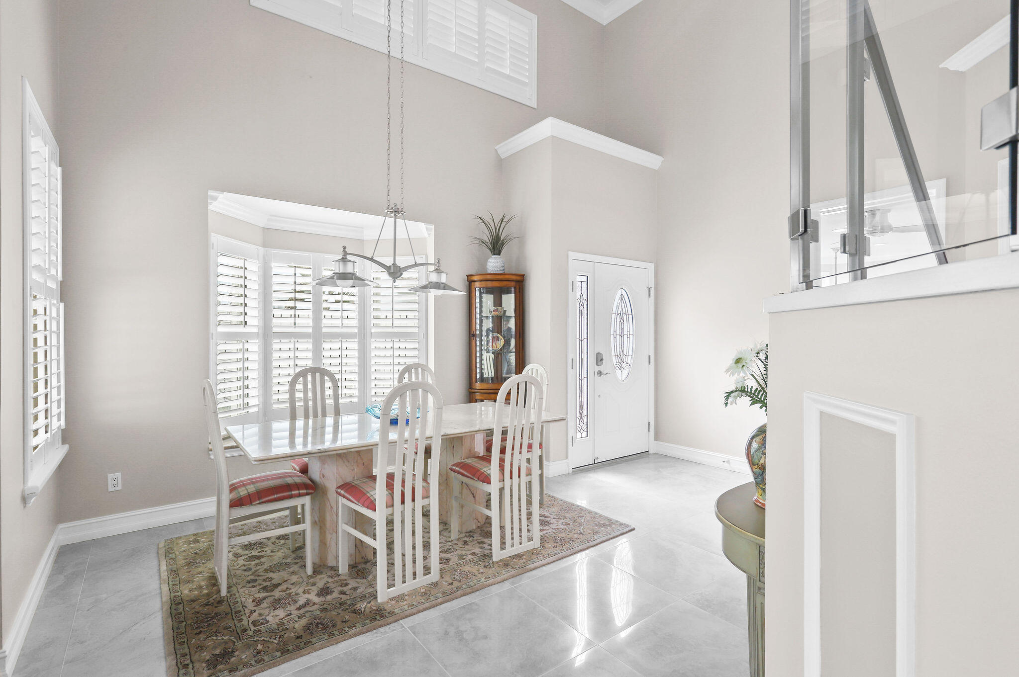 2056 Windward Way Jupiter, FL 33477 - Photo 8 of 58 a dining room with furniture and window