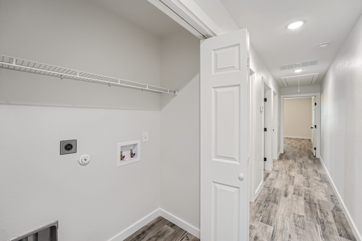 111 Fisher Street, Unit A & B Elgin, TX 78621 - Photo 9 of 13 a view of a hallway with wooden floor