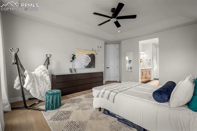 a bed room with a bed and a chandelier