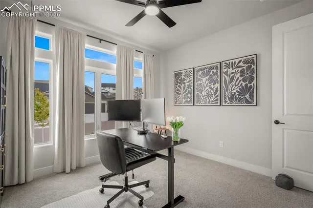 a workspace with furniture and window