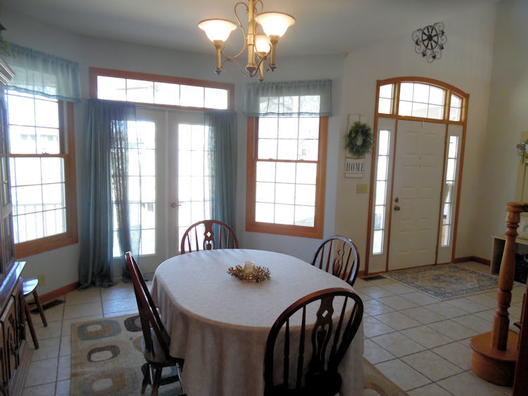 9261 Oak Ridge Drive Rochelle, IL 61068 - Photo 8 of 22 a view of a dining room with furniture and windows