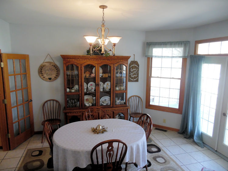 9261 Oak Ridge Drive Rochelle, IL 61068 - Photo 9 of 22 a view of a dining room with furniture window and outside view