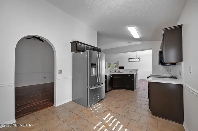 a kitchen with a stove and a microwave