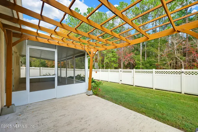 a view of a field with grass and a bench