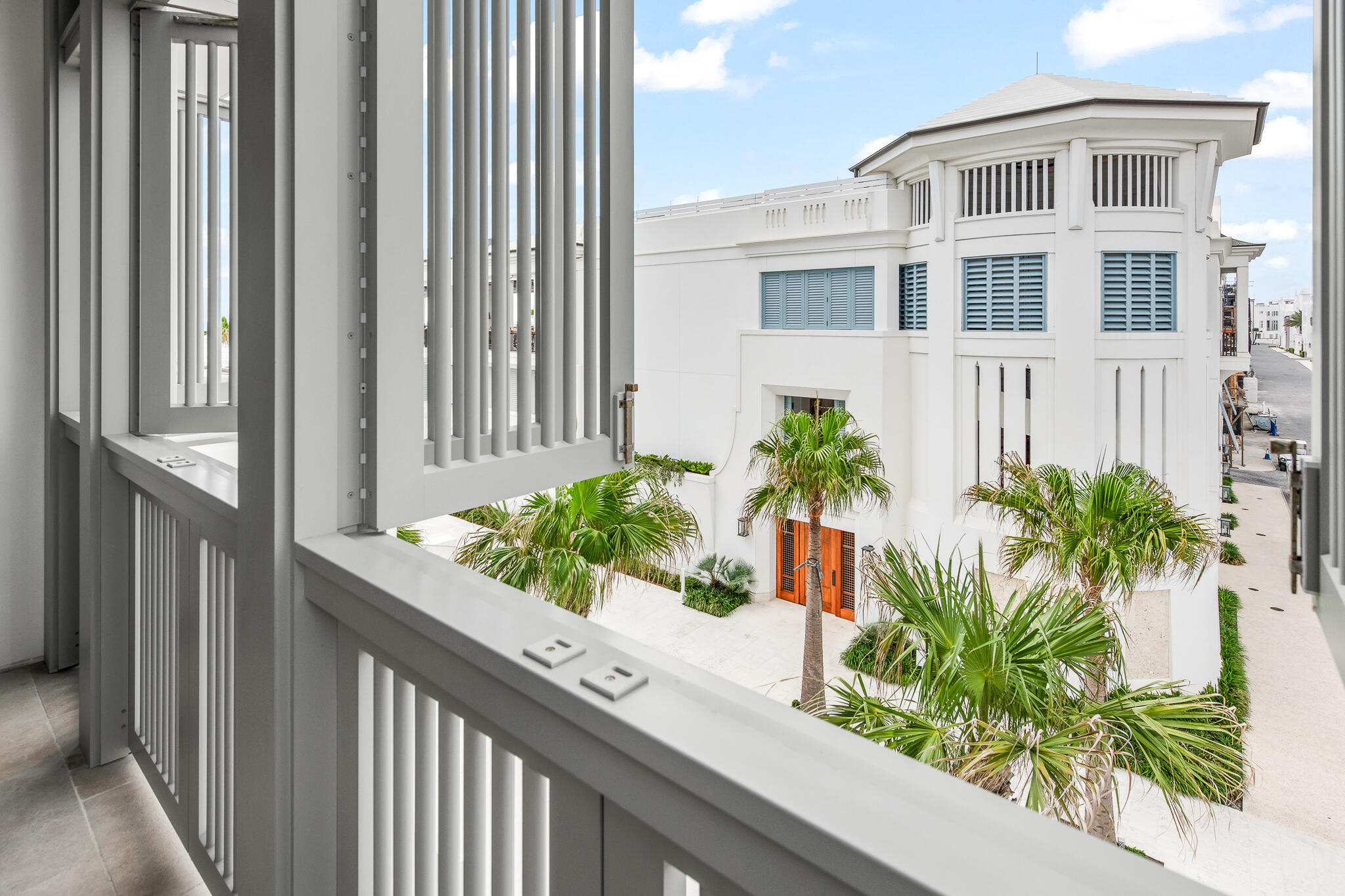 290 Sea Gardens St Inlet Beach, Unit 301 Inlet Beach, FL 32461 - Photo 12 of 43 a view of a potted plants next to a building
