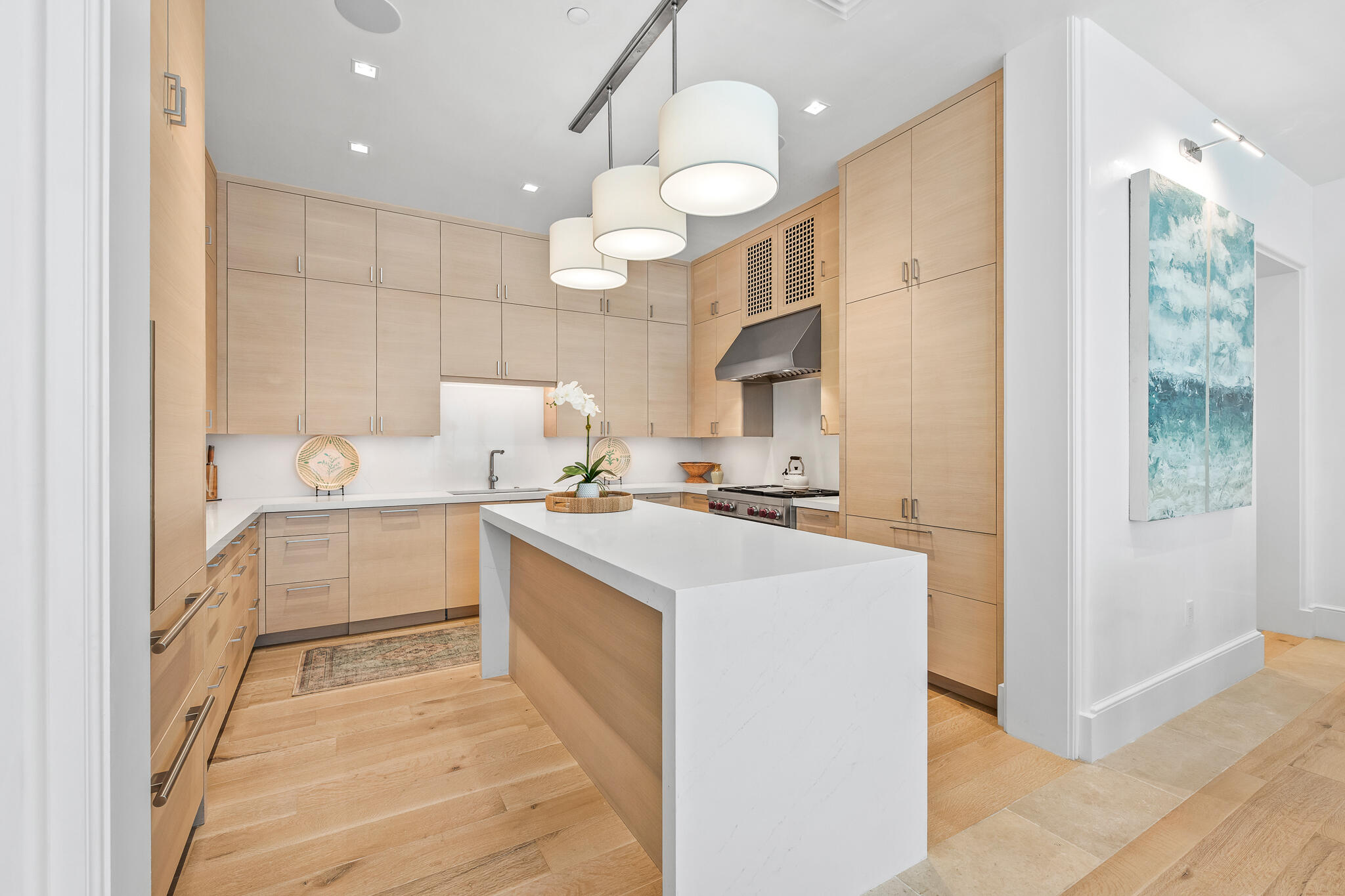 290 Sea Gardens St Inlet Beach, Unit 301 Inlet Beach, FL 32461 - Photo 19 of 43 a kitchen that has a lot of white cabinets and stainless steel appliances