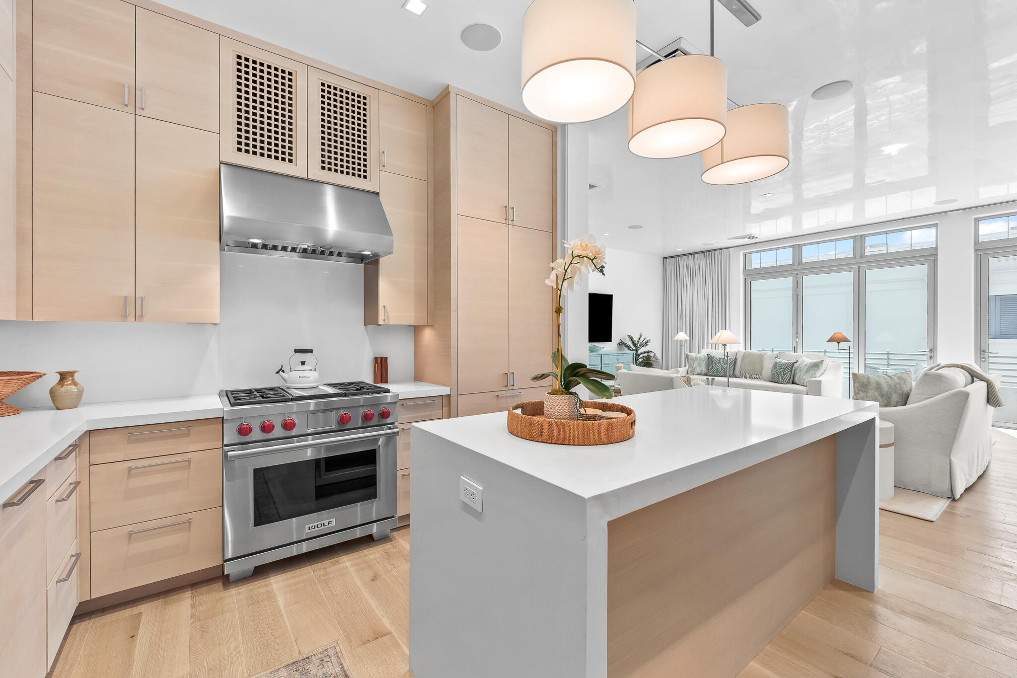 290 Sea Gardens St Inlet Beach, Unit 301 Inlet Beach, FL 32461 - Photo 27 of 43 a kitchen with stainless steel appliances a stove a sink and a white cabinets