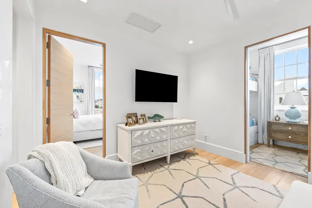 a en suite bathroom with a granite countertop tub mirror and shower