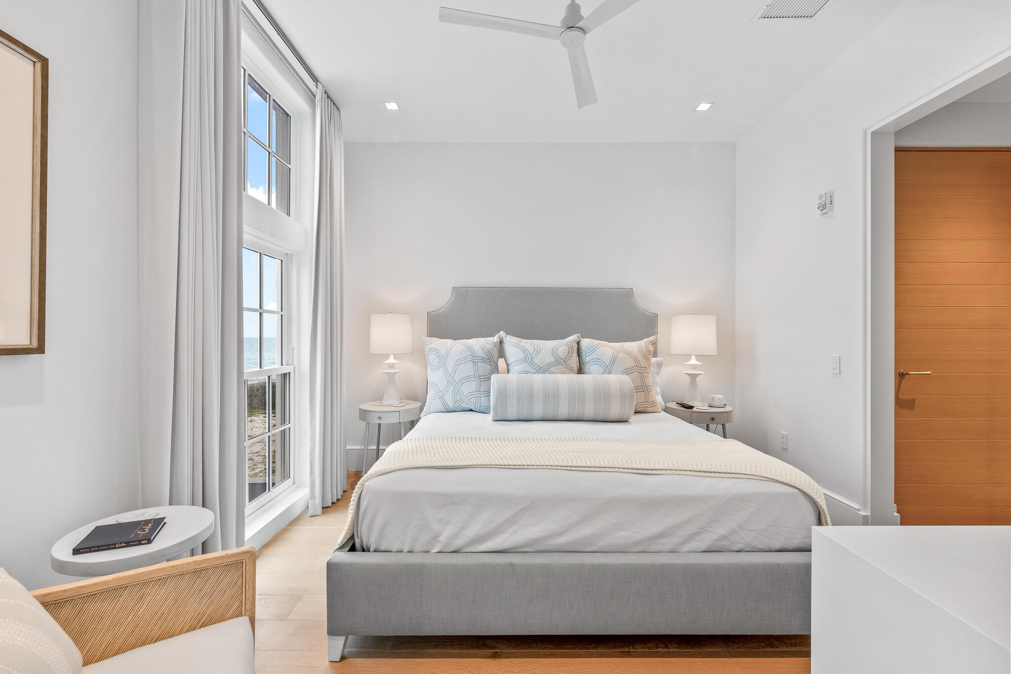 290 Sea Gardens St Inlet Beach, Unit 301 Inlet Beach, FL 32461 - Photo 10 of 43 a bedroom with a large bed and a potted plant