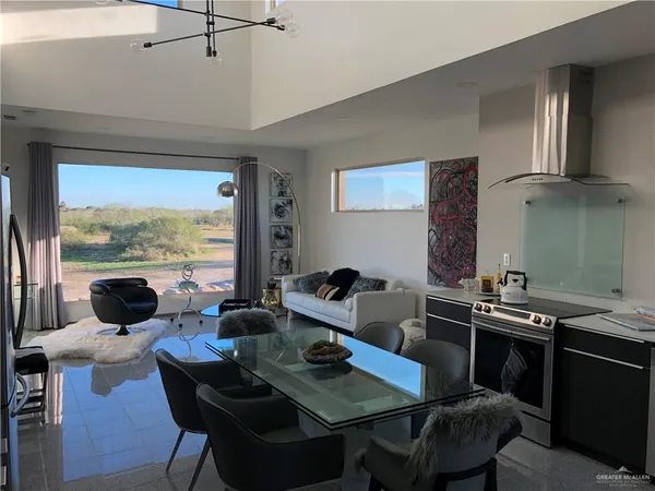 a view of a dining room with furniture window and outside view