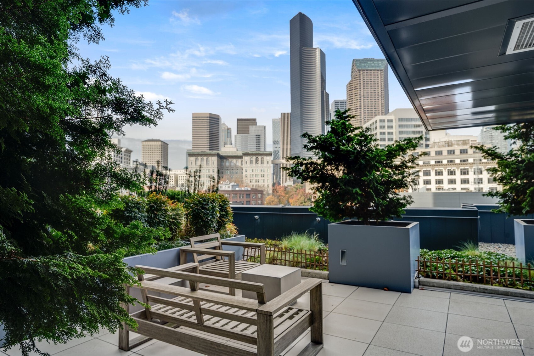 450 South Main Street, Unit 616 Seattle, WA 98104 - Photo 21 of 40 a view of a patio with couches and potted plants