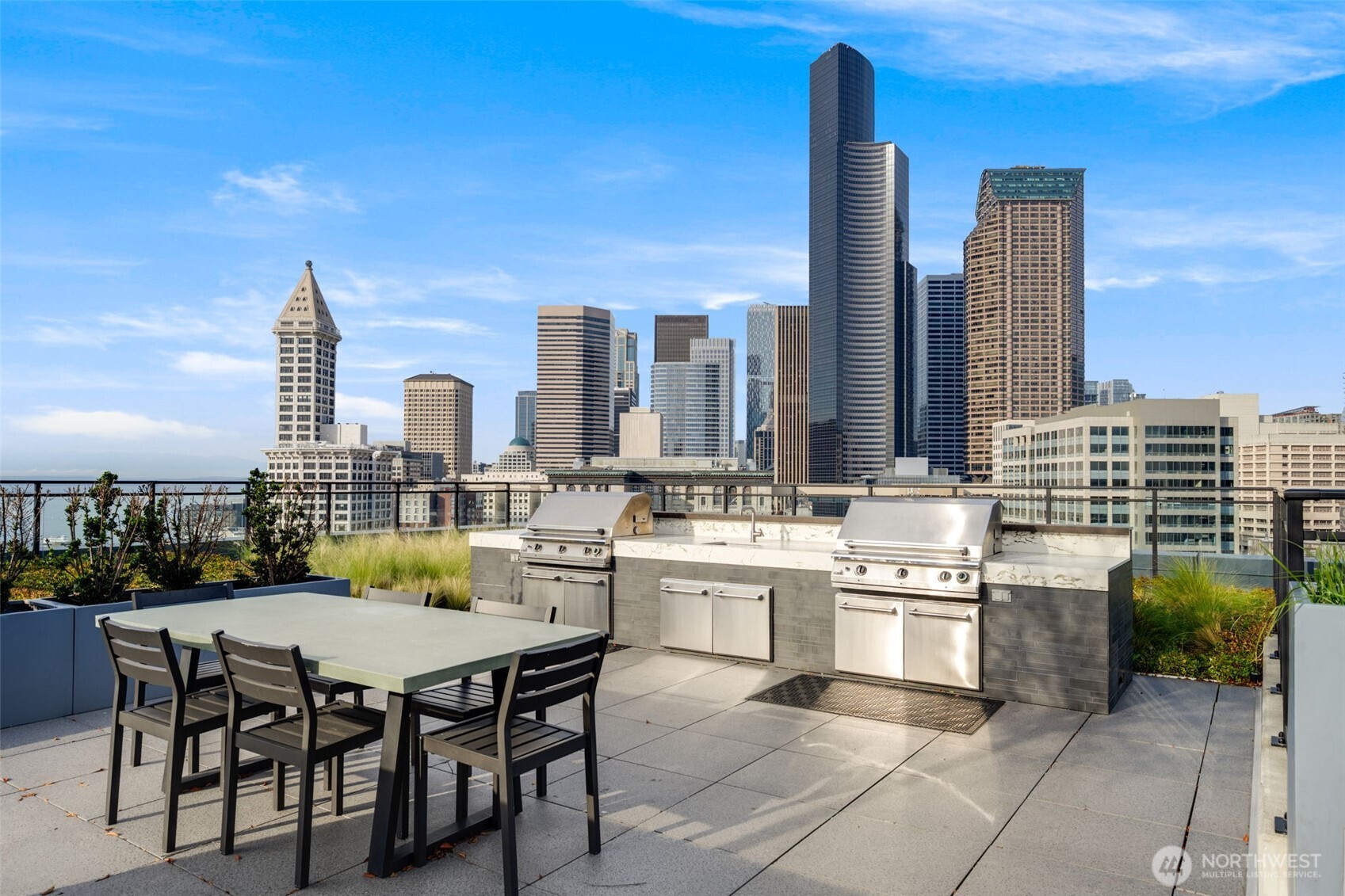 450 South Main Street, Unit 616 Seattle, WA 98104 - Photo 22 of 40 a dinning table and chairs in the patio