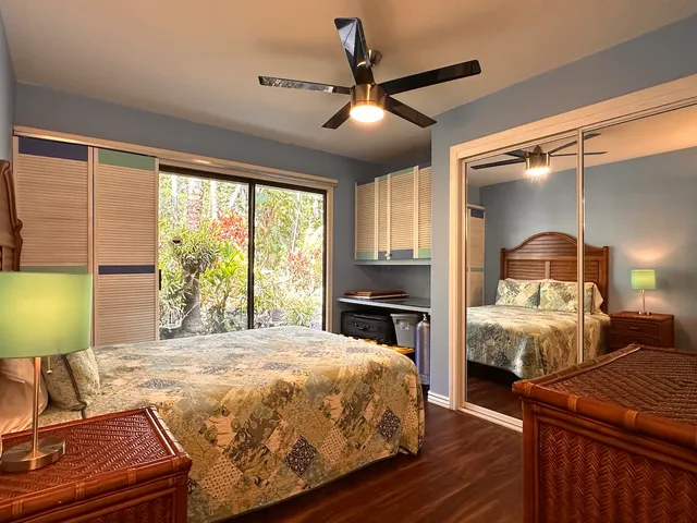 a bedroom with a bed lamps and window