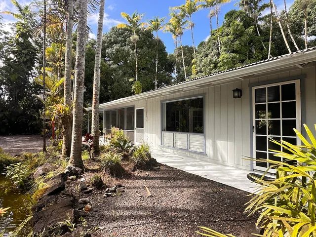 a house view with a backyard space
