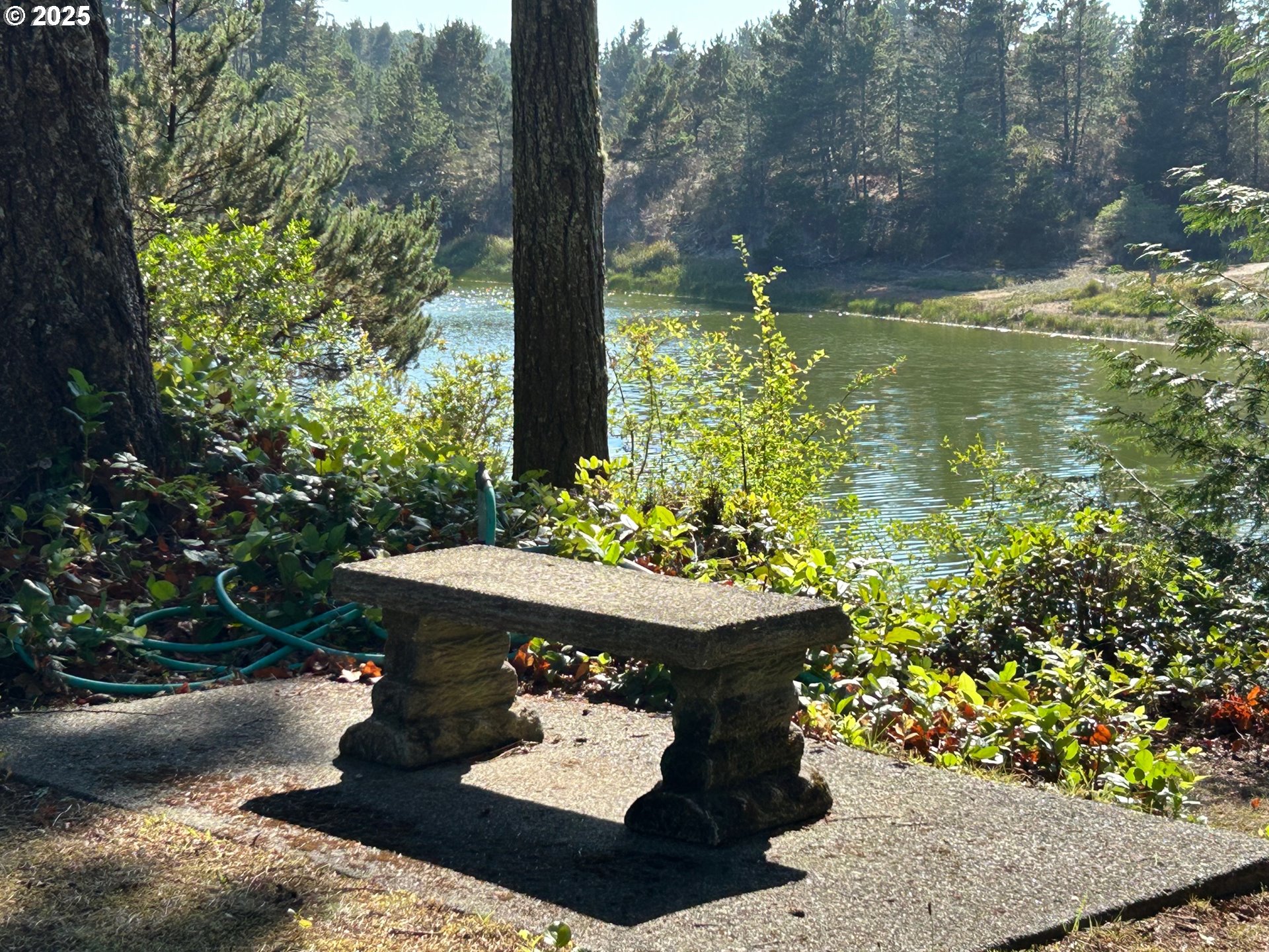89510 Highway 101, Unit 26 Florence, OR 97439 - Photo 3 of 16 a view of a couches in the patio with a table