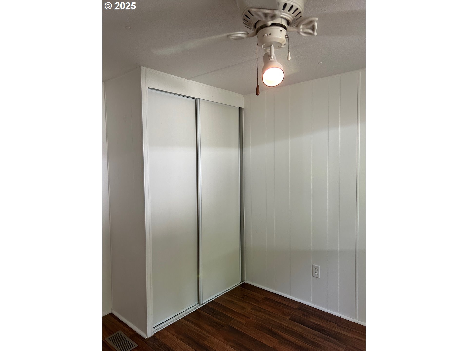 89510 Highway 101, Unit 26 Florence, OR 97439 - Photo 10 of 16 a bathroom with a light fixture and a mirror