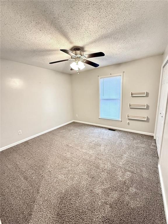 334 Summit Heights Drive Nicholson, GA 30565 - Photo 14 of 25 an empty room with windows and fan