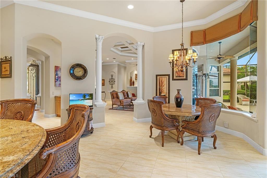 7511 Hogan Court Naples, FL 34113 - Photo 14 of 50 a living room with furniture and a large window