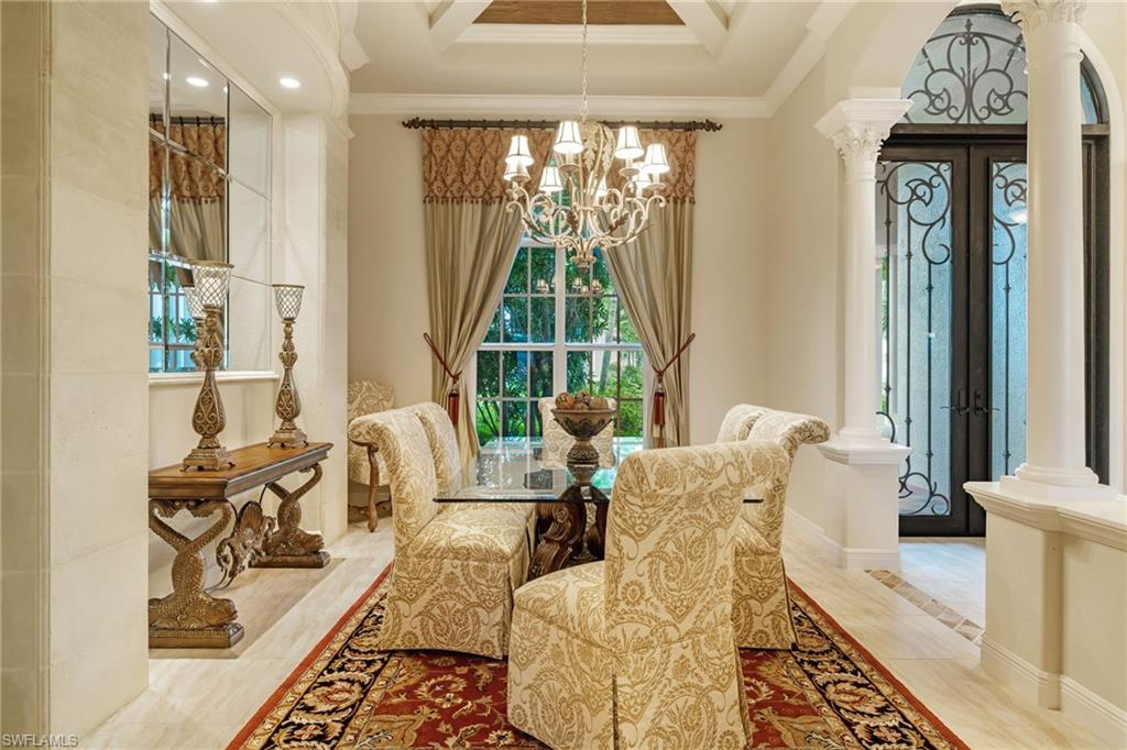 7511 Hogan Court Naples, FL 34113 - Photo 17 of 50 a living room with furniture and a large window