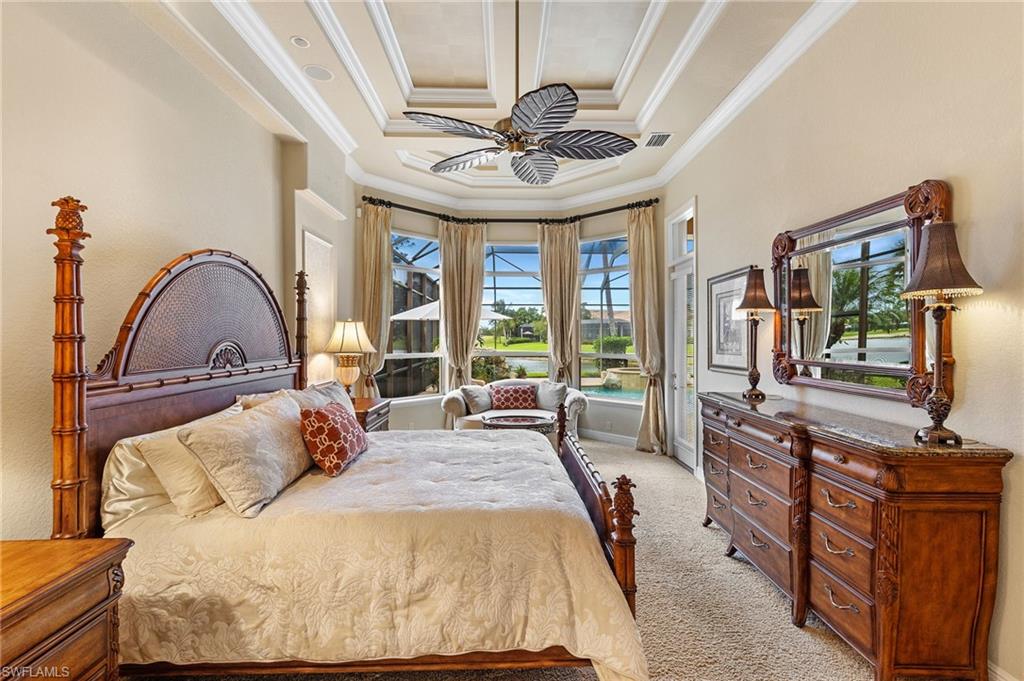 7511 Hogan Court Naples, FL 34113 - Photo 21 of 50 a bedroom with furniture and a large window