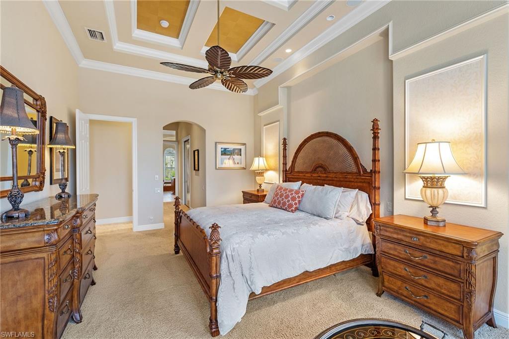 7511 Hogan Court Naples, FL 34113 - Photo 24 of 50 a bedroom with a bed and a dresser