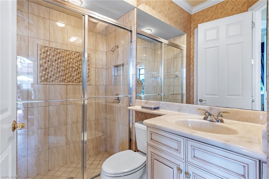 7511 Hogan Court Naples, FL 34113 - Photo 30 of 50 a bathroom with a sink toilet and shower