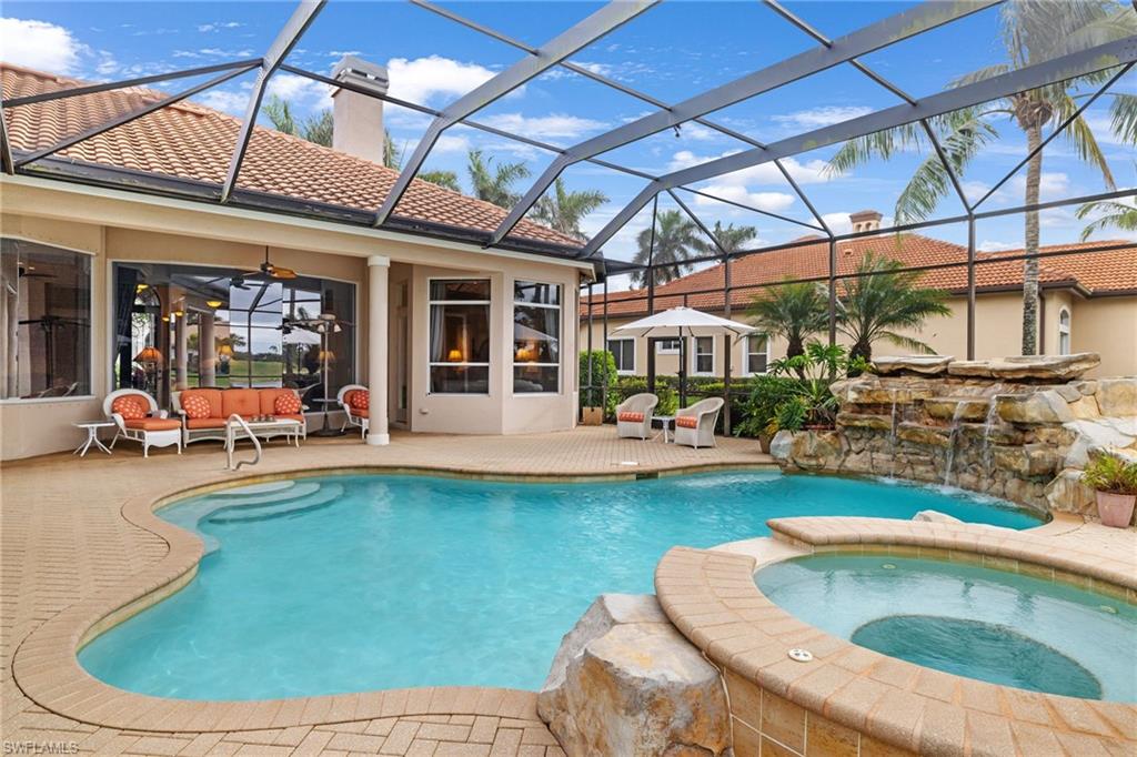 7511 Hogan Court Naples, FL 34113 - Photo 37 of 50 a view of a swimming pool with a patio