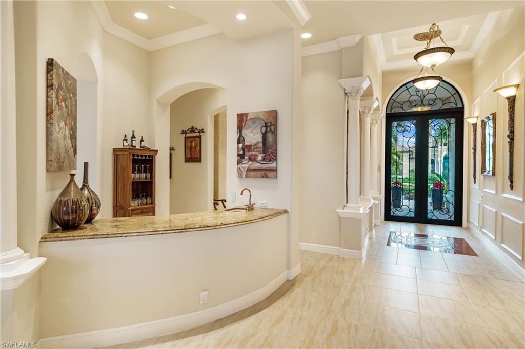 7511 Hogan Court Naples, FL 34113 - Photo 4 of 50 a view of a living room and bathroom
