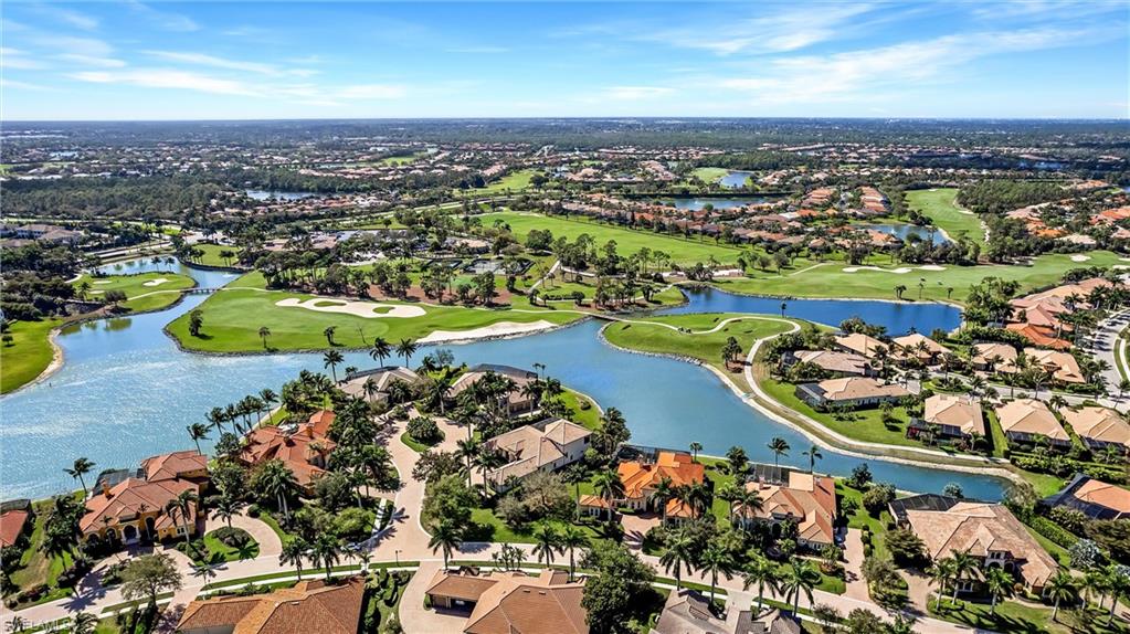 7511 Hogan Court Naples, FL 34113 - Photo 45 of 50 an aerial view of a city and mountain view in back