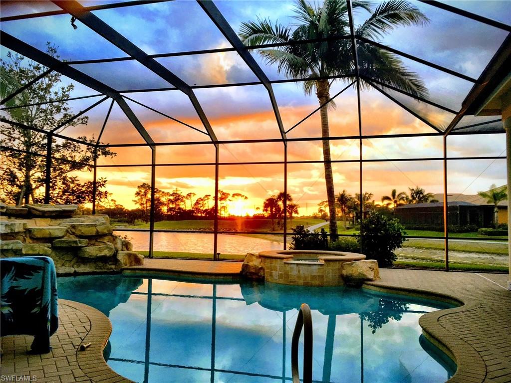 7511 Hogan Court Naples, FL 34113 - Photo 48 of 50 a roof deck with table and chairs