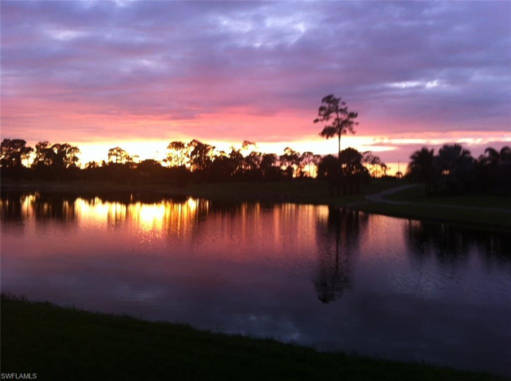 7511 Hogan Court Naples, FL 34113 - Photo 50 of 50 a sunset view with a lake