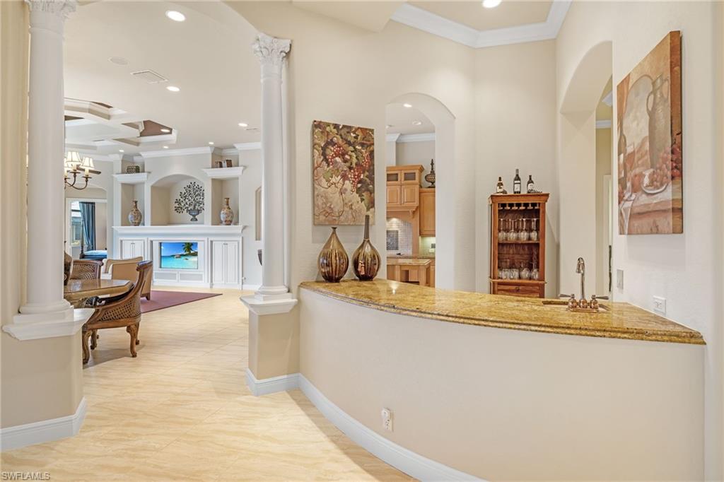 7511 Hogan Court Naples, FL 34113 - Photo 5 of 50 a living room with stainless steel appliances kitchen island granite countertop furniture and a view of living room