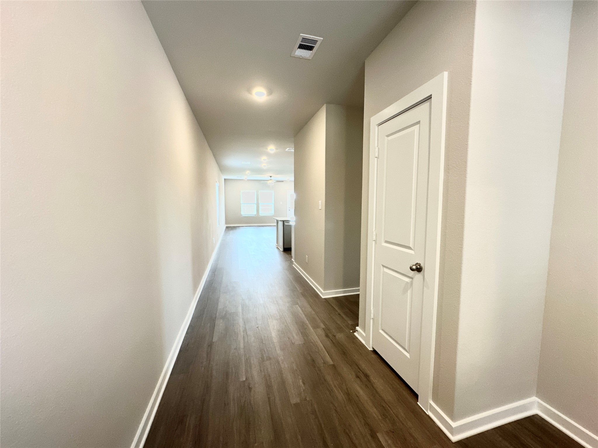 12164 Ridge Top Drive Conroe, TX 77304 - Photo 3 of 23 a view of a hallway with wooden floor