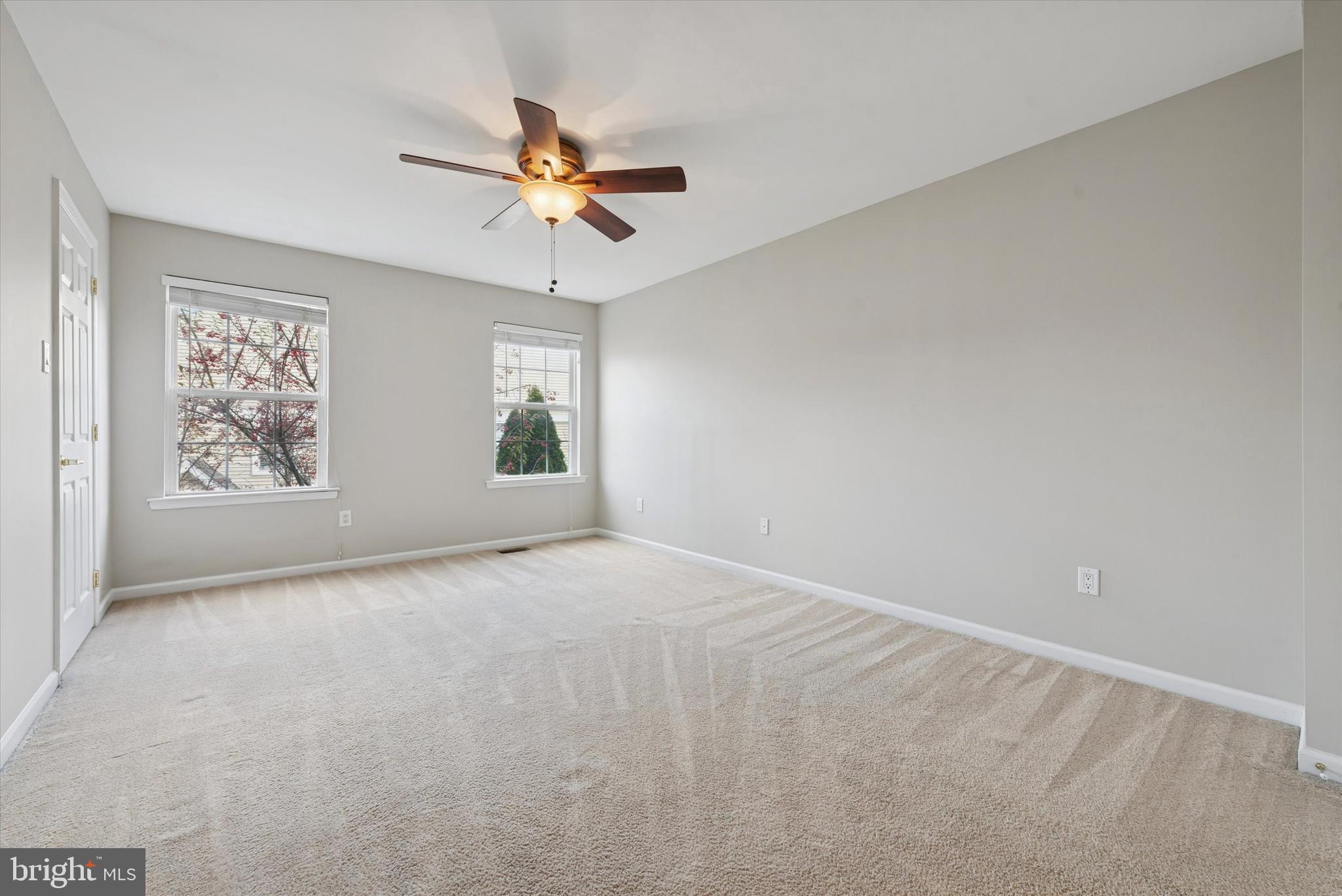 63 Granite Lane, Unit 2 Chester Springs, PA 19425 - Photo 12 of 15 an empty room with windows and fan