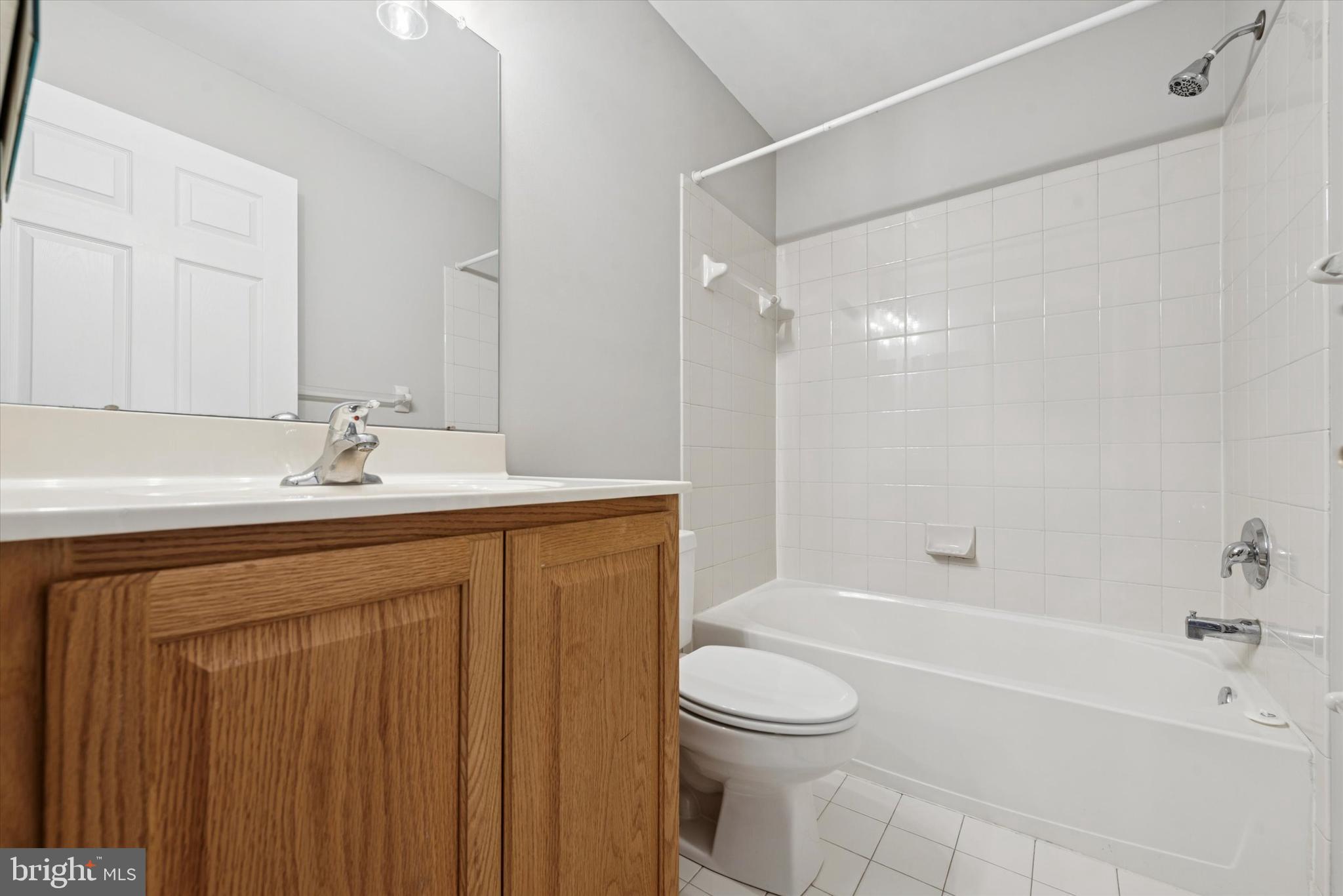 63 Granite Lane, Unit 2 Chester Springs, PA 19425 - Photo 15 of 15 a bathroom with a sink a toilet and a bathtub