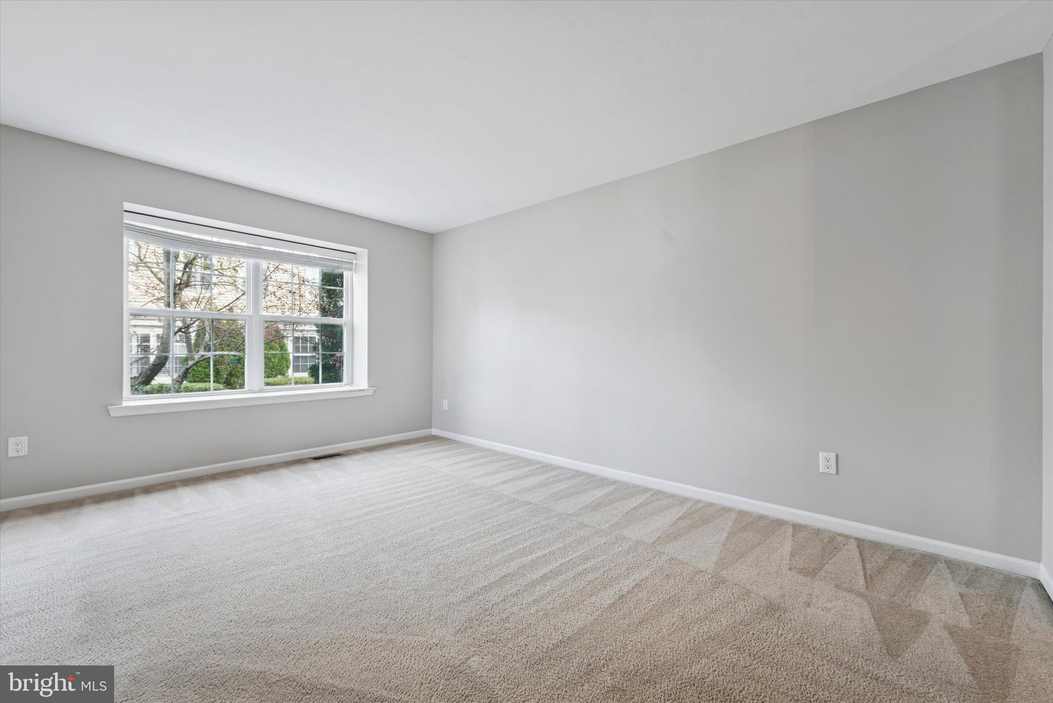 63 Granite Lane, Unit 2 Chester Springs, PA 19425 - Photo 8 of 15 an empty room with windows