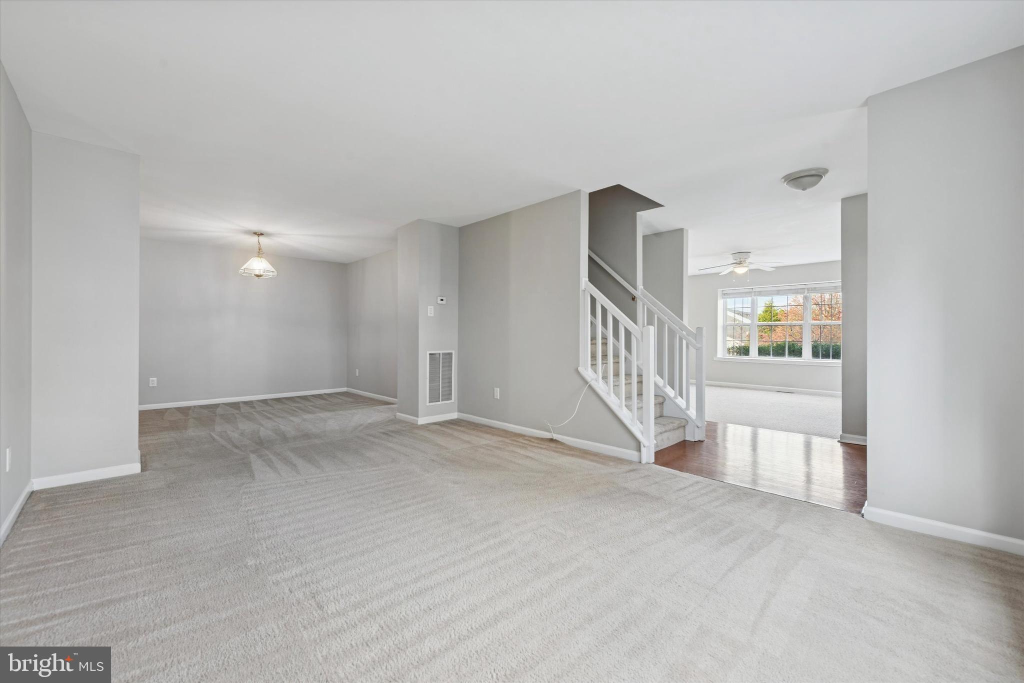 63 Granite Lane, Unit 2 Chester Springs, PA 19425 - Photo 9 of 15 a view of an empty room with stairs and a window