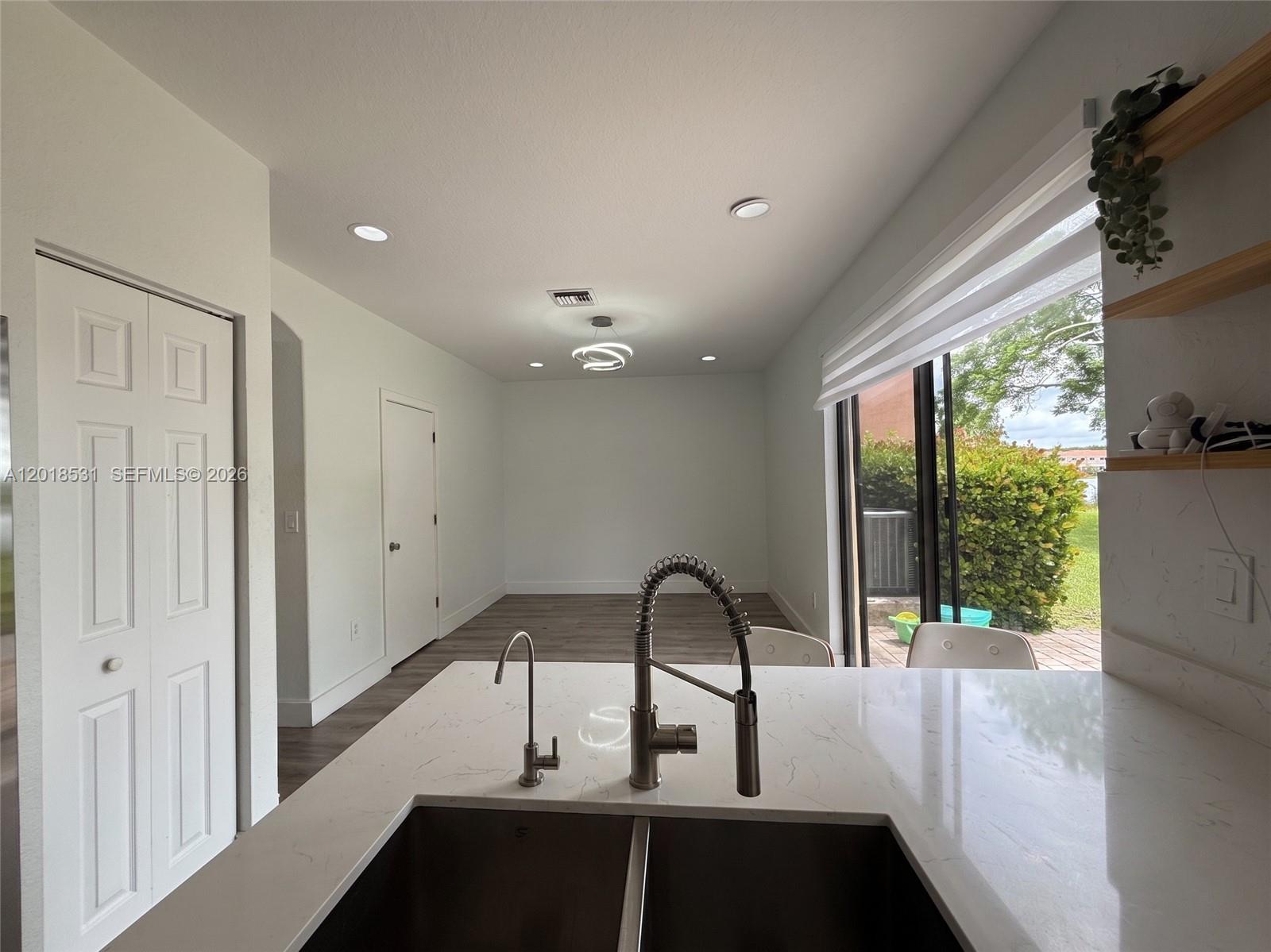 1575 Southeast 20th Road Homestead, FL 33035 - Photo 5 of 19 a view of a large window with an outdoor space