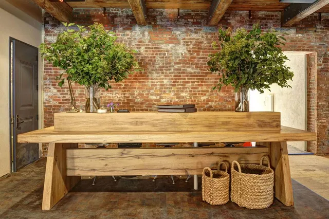 a view of a patio with table and chairs and plants