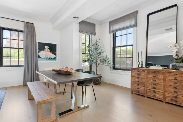 an aerial view of multi story residential apartment building with a yard