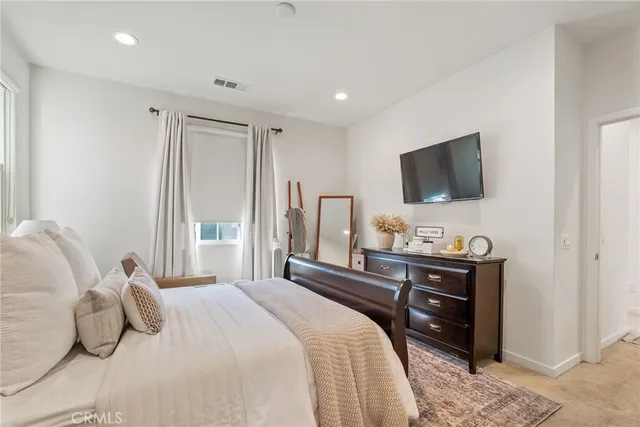 a view of a balcony with chairs and a barbeque